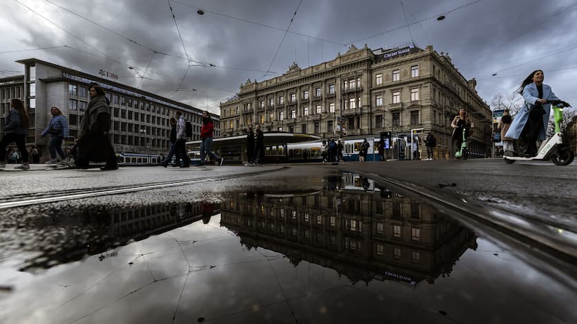 A general view shows the headquarters of the Swiss banks Credit Suisse, right, and UBS, left, at Paradeplatz in Zurich, Switzerland on Sunday March 19, 2023. (KEYSTONE/Michael Buholzer).