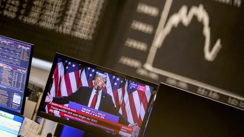 Donald Trump appears on a television screen at the stock market in Frankfurt, Germany, Wednesday, Nov. 6, 2024. (AP Photo/Michael Probst)