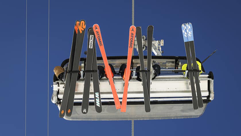 Skiers ride a lift as they enjoy the snow and sunny weather during one of the first weekends after the opening of the ski season in the alpine resort of Verbier, Sunday, December 1, 2024. (KEYSTONE/Valentin Flauraud)