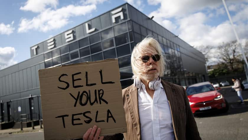 epa11965724 Demonstrators gather outside a Tesla dealership to protest businessman Elon Musk's current role in US President Donald Trump's administration and his controversial political positions, in Park Royal, London, Britain, 15 March 2025. Campaigners encouraged people to boycott the Tesla brand, sell the cars they already own and dump the company's stock to impact the co-founder and CEO of Tesla. EPA/TOLGA AKMEN