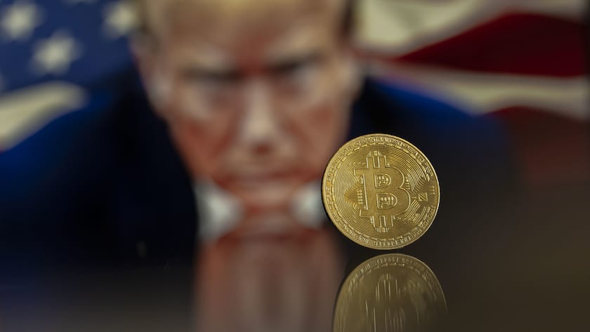 A symbolic Bitcoin in front of a Donald Trump portrait, in Lugano, Switzerland, Friday, November 22, 2024. The most important crypto currency hit a record high on Thursday and is approaching the 100'000 dollars per coin mark. Bitcoin has been regularly hitting fresh records this month on hopes that Trump will usher in a golden age of crypto.(KEYSTONE/Ti-Press/Pablo Gianinazzi)