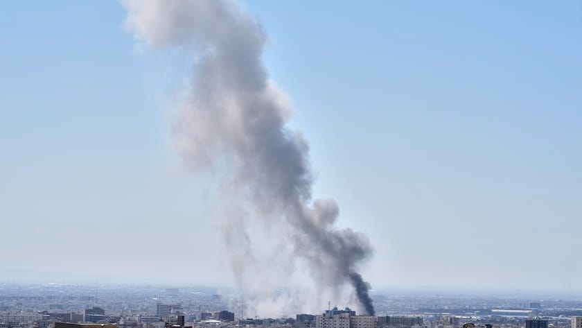 A plume of smoke rises after a strike in Tehran, Iran, Sunday, March 1, 2026. (AP Photo/Vahid Salemi)
