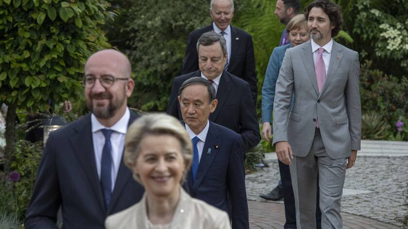 US President Joe Biden, bckground centre and other leaders walk to take a group photo, during a reception for the G7 leaders at the Eden Project in Cornwall, England, Friday June 11, 2021, during the G7 summit. (Jack Hill/Pool via AP)