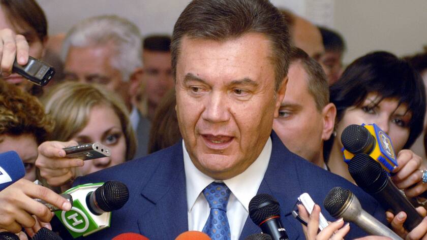 Viktor Yanukovych, the leader of Party of the Regions answers journalist's questions in Kiev, Ukraine, Tuesday June 20, 2006. A pro-Russian party that won the most seats in Ukraine's parliament warned on Tuesday that it would try to take control of parliament if no quick deal is made in coalition talks with President Viktor Yushchenko's bloc. (AP Photo/Sergei Chuzavkov)