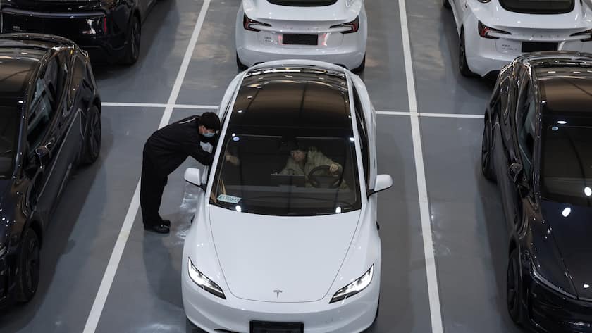epa11927375 A new owner of the revised Tesla Model Y picks up thier car at a delivery center in Beijing, China, 27 February 2025. Tesla began delivering the revised Model Y in China on 26 February. All of the cars parked in the indoor parking lot have already been sold to customers. EPA/JESSICA LEE