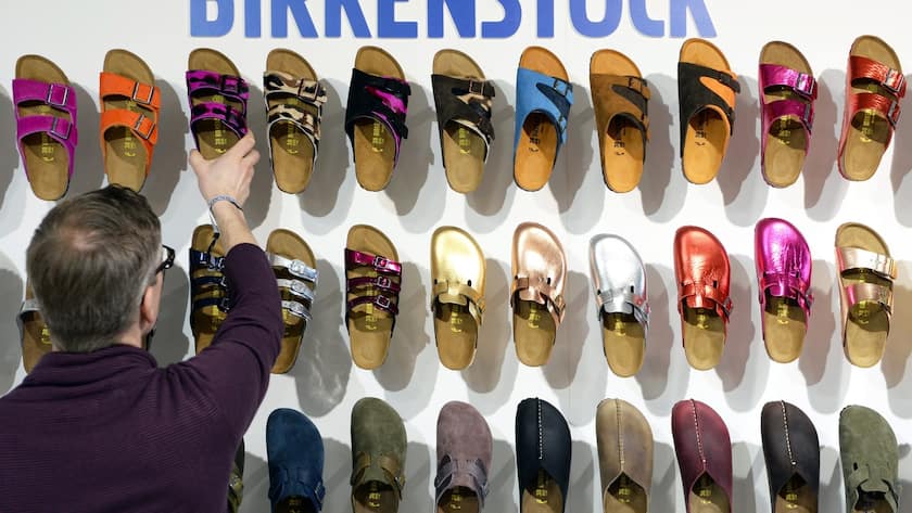 epa04021198 A employee arranges shoes of German label Birkenstock during the fashion fair 'Bread & Butter' in the former Tempelhof airport in Berlin, Germany, 14 January 2014. 'B&B' takes place during the Berlin Fashion Week that presents the Autumn/Winter 2014/2015 collections and runs from 11 to 14 January. EPA/SOEREN STACHE