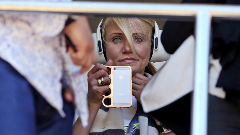 US actress Cameron Diaz watches in the pits prior to the start of the Formula One Grand Prix at the Monaco racetrack, in Monaco, Sunday, May 26, 2013. (AP Photo/Luca Bruno)