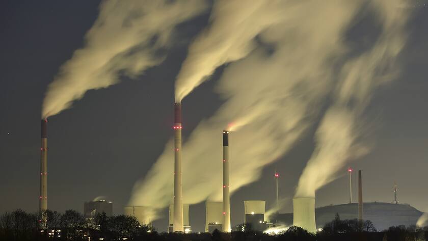 Smoke streams from the chimneys of the E.ON coal-fired power station in Gelsenkirchen, Germany, Monday night, Nov. 24, 2014, and with a capacity of around 2300 MW of power it is one of the most powerful coal-fired power stations in Europe. Coal power plants are under pressure due to the German targets for reducing carbon-dioxide emissions. (AP Photo/Martin Meissner)