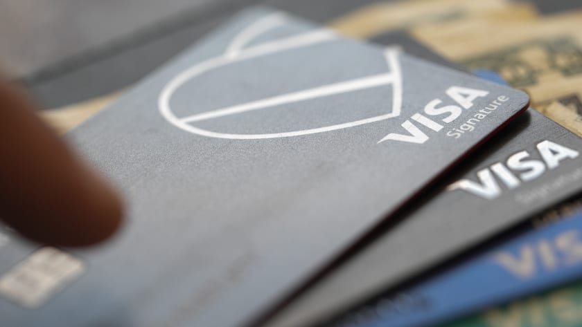This Sunday, Aug. 11, 2019, photo shows Visa logos on credit cards in New Orleans. (AP Photo/Jenny Kane)