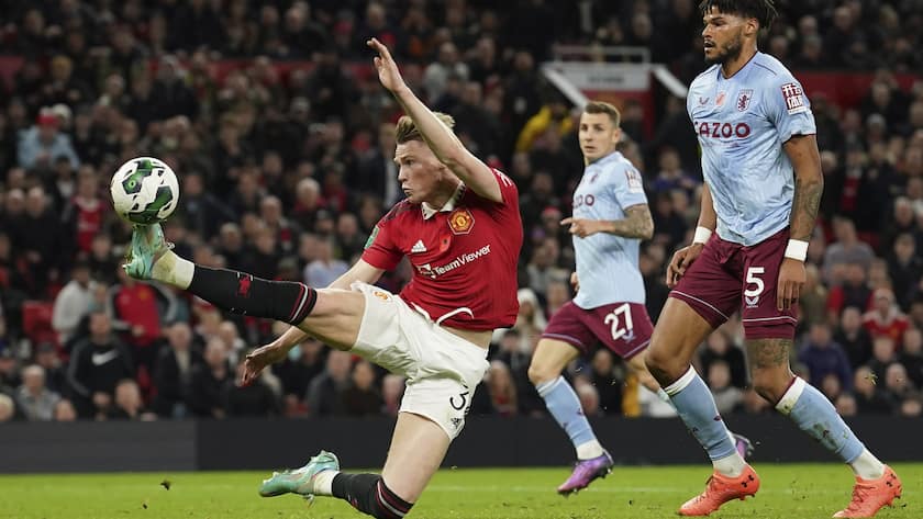 Manchester United's Scott McTominay scores his side's fourth goal during the English League Cup third round soccer match between Manchester United and Aston Villa in Manchester, England, Thursday, Nov. 10, 2022. (AP Photo/Dave Thompson)