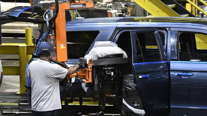 Workers assembling Ford trucks at the Ford Kentucky Truck Plant, Friday, Oct. 27, 2017, in Louisville, Ky. (AP Photo/Timothy D. Easley)