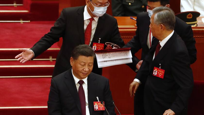 epa10258169 China's former President Hu Jintao (R) is led out as President Xi Jinping (L) looks on during the closing ceremony of the 20th National Congress of the Communist Party of China (CPC) at the Great Hall of People in Beijing, China, 22 October 2022. The 20th National Congress of the Communist Party of China will close on 22 October with President Xi Jinping expected to secure a historic third five-year term in power. EPA/WU HAO
