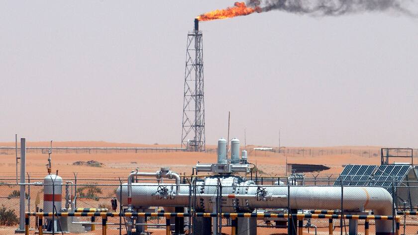 epa07968924 (FILE) - An image showing a gas flame behind pipelines in the desert at Khurais oil field, about 160 km from Riyadh, Kingdom of Saudi Arabia, 23 June 2008 (reissued 03 November 2019). According to media reports Saudi Arabia said it has approved plans for the state-owned oil producer Saudi Aramco to go public on the Saudi stock exchange Tadawul on 11 December 2019. EPA/ALI HAIDER