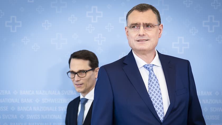 Swiss National Bank's (SNB) Chairman of the Governing Board Thomas Jordan, right, arrives with Vice Chairman of the Governing Board Martin Schlegel, left, to a media briefing at the Swiss National Bank in Zurich, Switzerland, on Thursday, March 21, 2024. (KEYSTONE/Michael Buholzer).