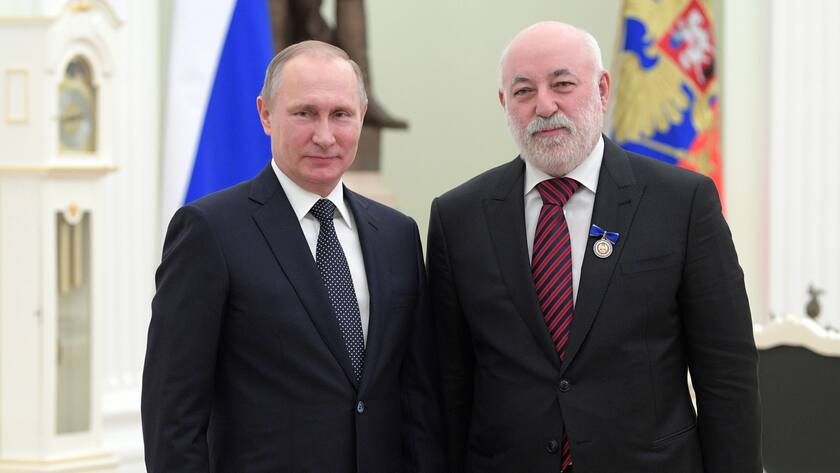 Russian President Vladimir Putin, left, poses for a photo with Renova CEO businessman Viktor Vekselberg