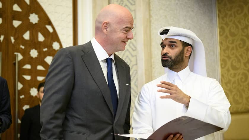 FIFA president Gianni Infantino, left, speaks with Hassan Al Thawadi, Secretary General of the World Cup organizing committee before the Team Seminar on the sideline of the draw for the 2022 FIFA World Cup, in Doha, Qatar, Friday, April 1, 2022. The Swiss national soccer team is qualified for the upcoming FIFA World Cup in Qatar from Nov. 21, 2022, to Dec. 18, 2022. (KEYSTONE/Laurent Gillieron)