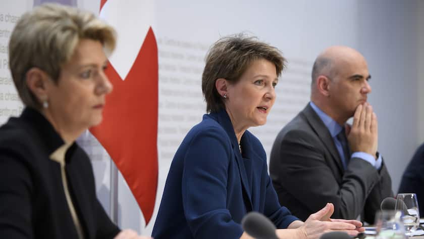 Swiss Federal president Simonetta Sommaruga, center, briefs the media about the latest measures to fight the Covid-19 Coronavirus pandemic next to Swiss Federal councillor Karin Keller-Sutter, left, and Swiss Federal councillor Alain Berset, right, in Bern, Switzerland, Monday, March 16, 2020. (KEYSTONE/Anthony Anex)