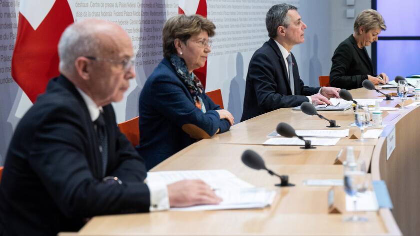epa09791952 (L-R) Swiss Federal Councillors Ueli Maurer (Federal Department of Finance - FDF), Viola Amherd (Federal Department of Defence, Civil Protection and Sport - DDPS), Swiss Federal President Ignazio Cassis and Federal Councillor Karin Keller Sutter (Federal Department of Justice and Police - FDJP), at a media conference to announce that Switzerland would follow the European Union (EU) in sanctioning Russia and freezing Russian assets, in Bern, Switzerland, 28 February 2022. EPA/PETER SCHNEIDER