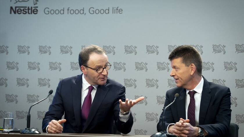 Nestle's CEO Ulf Mark Schneider, left, speaks with Nestle's CFO Francois-Xavier Roger, right, for the 2019 full-year results press conference of the food and drinks giant Nestle, in Vevey, Switzerland, Thursday, February 13, 2020. (KEYSTONE/Laurent Gillieron)