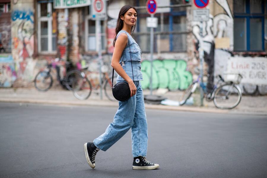 BERLIN, GERMANY - AUGUST 24: Alyssa Cordes wearing ripped off denim shirt Weekday, cropped denim jeans Weekday (natural born human), Converse chucks, Lili Radu bag on August 24, 2018 in Berlin, Germany. (Photo by Christian Vierig/Getty Images)