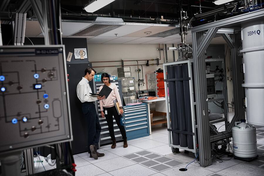 YORKTOWN HEIGHTS, N.Y. - OCTOBER 18: Neerja Sundaresan, Research Team Member, IBM Research, talking to Douglas McClure, next to IBM Q System One quantum computer on October 18, 2019 at IBM's research facility in Yorktown Heights, N.Y. (Photo by Misha Friedman/Getty Images)