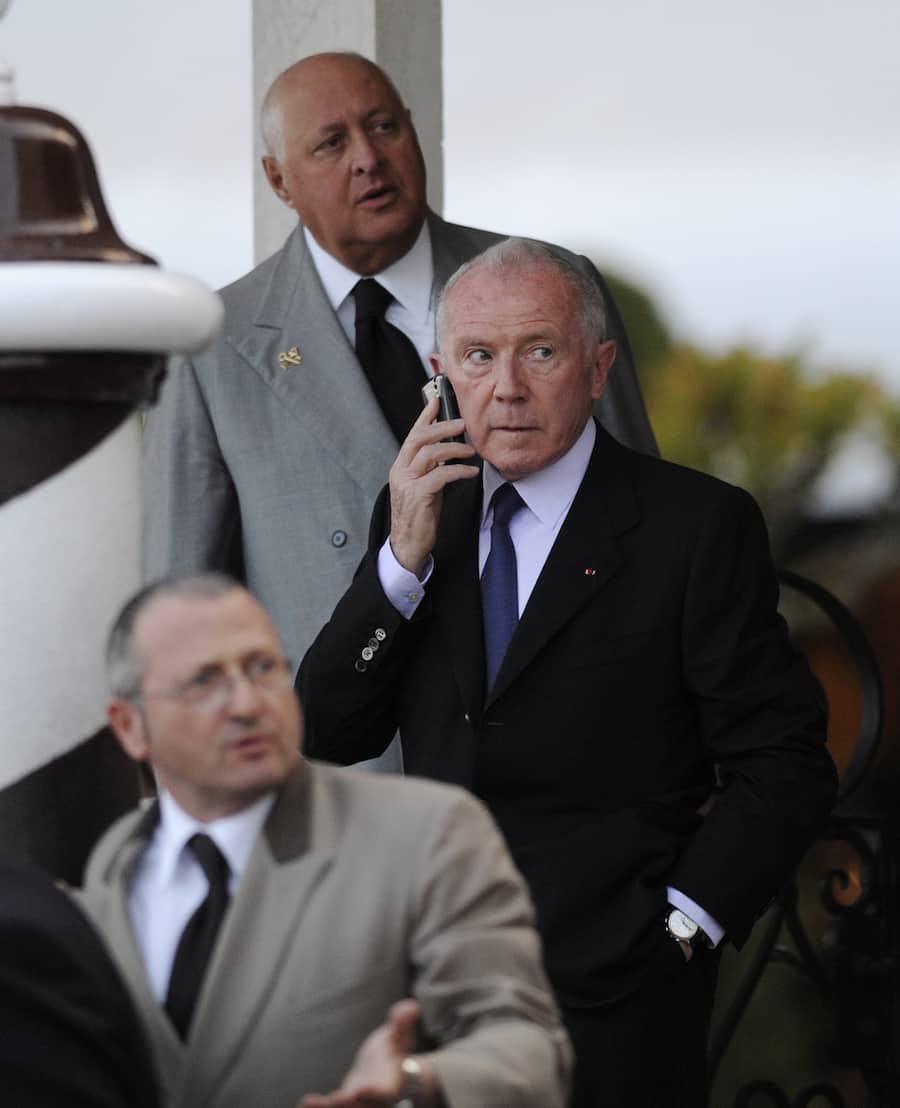 French businessman Francois Pinault, father of Francois-Henri Pinault, talks on a mobile phone as he prepares to board a boat for Punta della Dogana to celebrate the wedding of his son with actress Salma Hayek, in Venice, Italy, Friday, April 24, 2009. (AP Photo/Antonio Calanni)