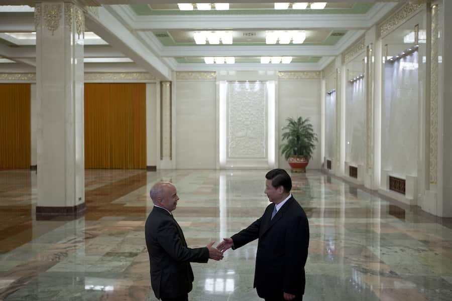 Swiss President Ueli Maurer, left, shakes hands with Chinese President Xi Jinping before their meeting at the Great Hall of the People in Beijing, China, Thursday, July 18, 2013. (AP Photo/Alexander F. Yuan, Pool)