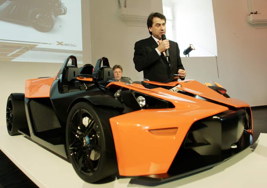 CEO of KTM Power Sports AG Stefan Pierer presents a model of their first car, the KTM X-Bow, on Monday, Feb. 5, 2007. The first roadworthy KTM X-Bow will be presented at the Geneva car show at the beginning of March. Sitting in the background is KTM's CEO Harald Ploeckinger. (AP Photo/Hans Punz)