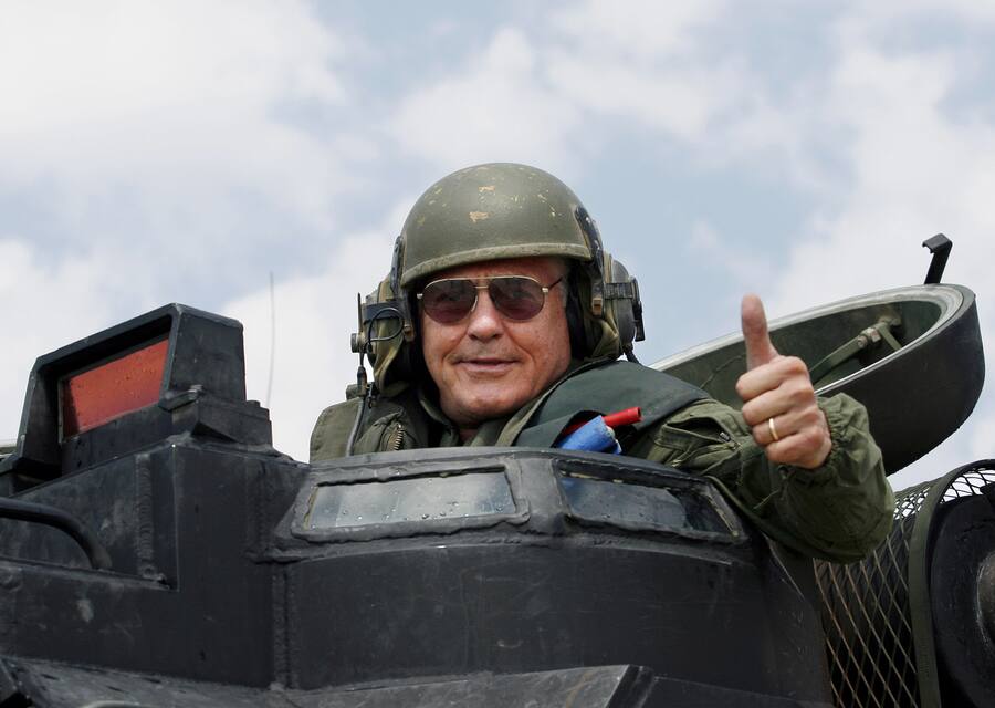 General Motors vice chairman Bob Lutz gives a thumbs up during a ride in a Marine Corps amphibious assault vehicle during a visit to Camp Pendleton Marine Corps Base, Calif. Thursday, Sept. 14, 2006. GM demonstrated their new hydrogen cell vehicles at the base in advance of GM's release of fuel cell vehicles.   (AP Photo/Denis Poroy)