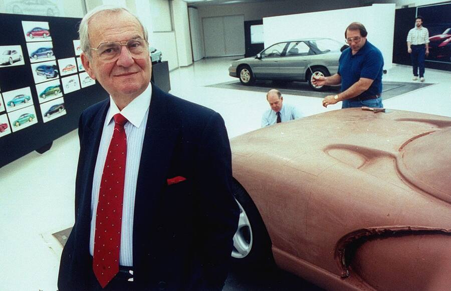 Chrysler Corp. Chmn. Lee Iacocca posing in front of full-sized clay model of the proposed Viper sports car being worked on by staff technicians in the Advanced International Design studio at the new Chrysler Tech Center. (Photo by Taro Yamasaki/The LIFE Images Collection via Getty Images/Getty Images)