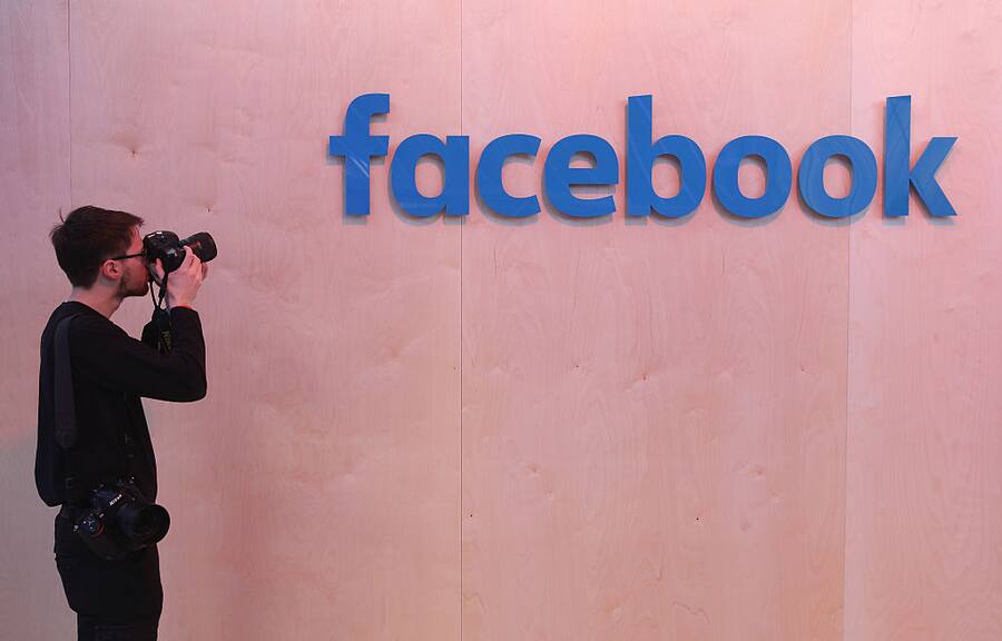 BERLIN, GERMANY - FEBRUARY 24: A photographer snaps a photo of the Facebook logo at the Facebook Innovation Hub on February 24, 2016 in Berlin, Germany. The Facebook Innovation Hub is a temporary exhibition space where the company is showcasing some of its newest technologies and projects. (Photo by Sean Gallup/Getty Images)
