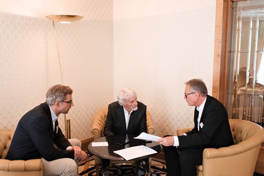 Bernie Ecclestone Stefan Barmettler und Marcel Speiser.
