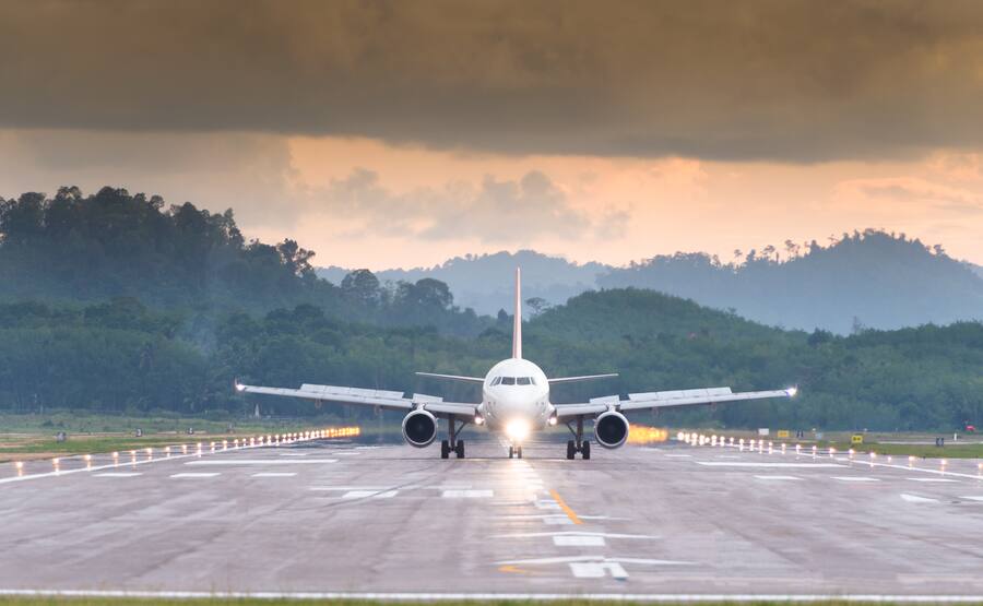 Passenger jet airplane before landing in the early morning.