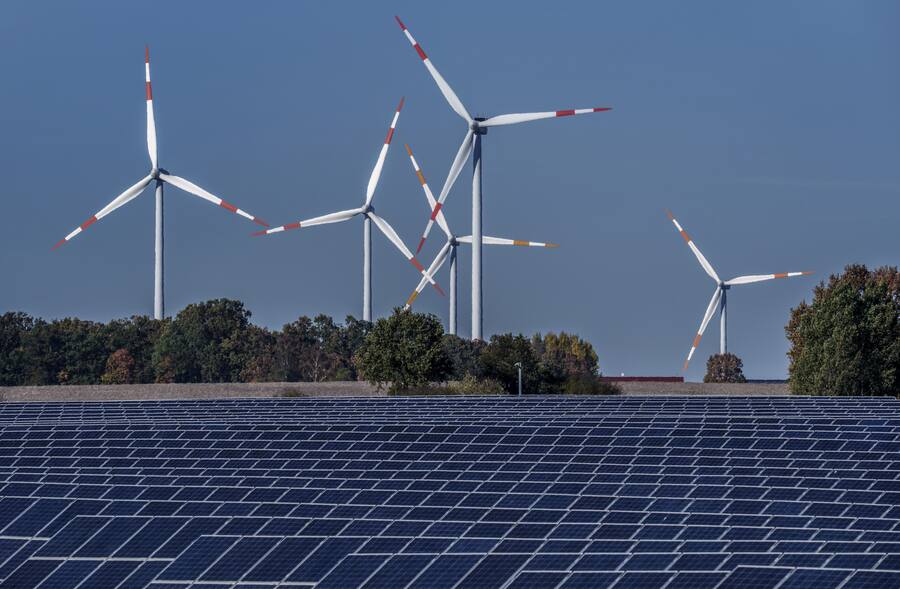 Wind turbines turn behind a solar farm in Rapshagen, Germany, Thursday, Oct. 28, 2021. Climate change is going to get worse, but as gloomy as the latest scientific reports are, including today‚Äôs from the United Nations, scientist after scientis…