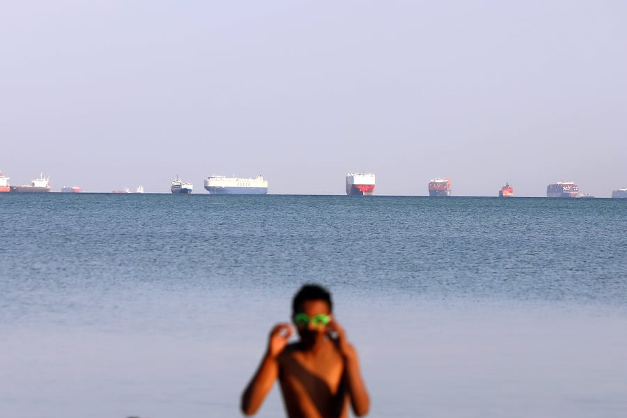 210325 -- CAIRO, March 25, 2021 -- Ships wait to pass the Suez Canal on the Great Bitter Lake, in the province of Ismailia, Egypt, March 25, 2021. Egypt s Suez Canal Authority SCA said on Thursday that it has temporarily suspended navigation through the world s busiest shipping course until the grounded cargo ship is completely freed. EGYPT-SUEZ CANAL-TRAFFIC-SUSPENSION AhmedxGomaa PUBLICATIONxNOTxINxCHN