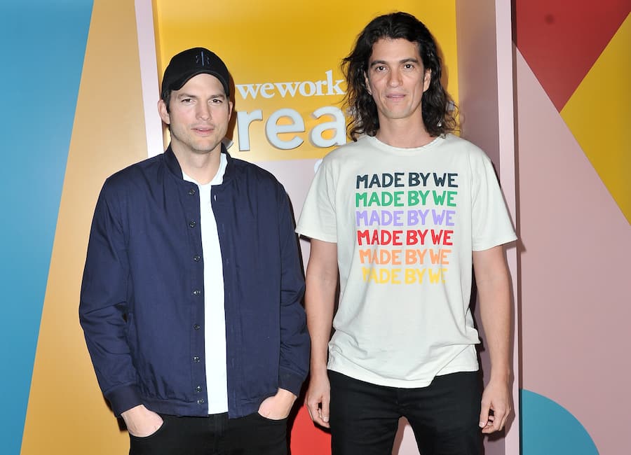 LOS ANGELES, CALIFORNIA - JANUARY 09: Ashton Kutcher (L) and Adam Neumann attend WeWork Creator Awards Global Finals at Microsoft Theater on January 09, 2019 in Los Angeles, California. (Photo by Allen Berezovsky/FilmMagic)
