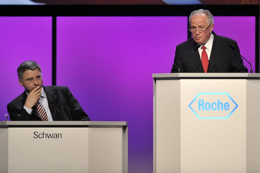 Franz B. Humer, chairman of the board of Roche, right, and CEO Severin Schwan, left, attend the general assembly of Swiss pharmaceutical company Roche Holding AG, in Basel, Switzerland, Tuesday, March 3, 2010. (KEYSTONE/Georgios Kefalas)