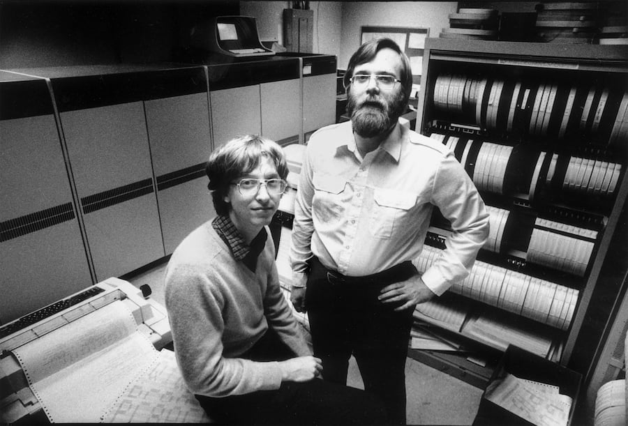 In 1981, computers the size of refrigerators and cabinets of tapes for reel-to-reel computer tape drives lined the walls in the small offices of Microsoft founders Bill Gates, left, and Paul Allen in Bellevue, Wash. In 1981 Microsoft employed 85 people. Since then Microsoft has moved to neighboring Redmond, Wash., and now employs 27,000 people. (KEYSTONE/AP Photo/Eastside Journal/Jim Hallas) === ===