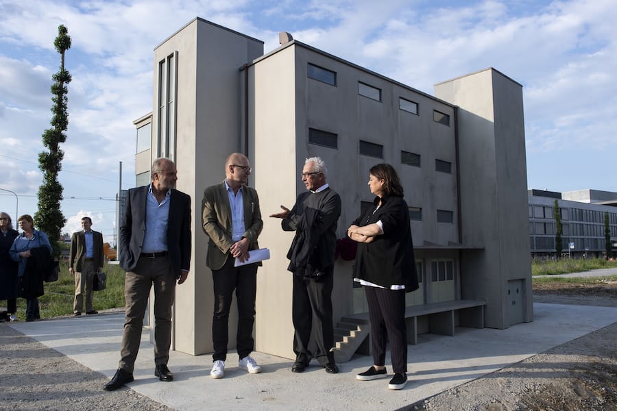 Swiss artist Peter Fischli, second right, speaks next to Filippo Leutenegger, left, Christoph Oswald, second left, and Maja Hoffmann, right, in the front of the artwork "Haus" in Zurich, Switzerland, on Wednesday, May 23, 2018. (KEYSTONE/Ennio Leanza)