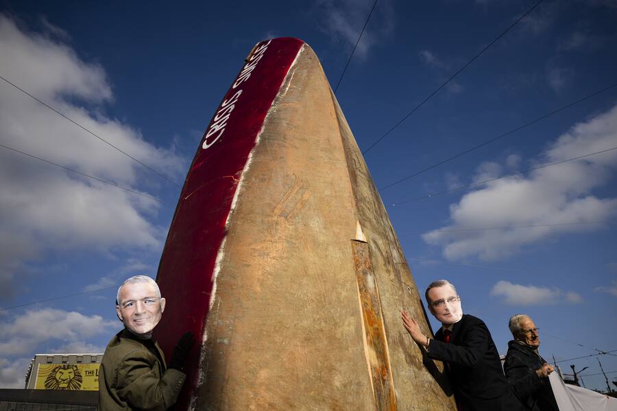 Protesters dressed as Swiss bank Credit Suisse Chairman Axel P. Lehmann, left, and Swiss National Bank's (SNB) Chairman of the Governing Board Thomas Jordan, right, demonstrate at the entrance of the annual shareholders' meeting of the Swiss banking group Credit Suisse on Tuesday, April 4, 2023 in Zurich, Switzerland. Swiss Bank Credit Suisse was rescued in a three billion dollars purchase by its Swiss rival UBS in a government-backed deal. (KEYSTONE/Michael Buholzer)