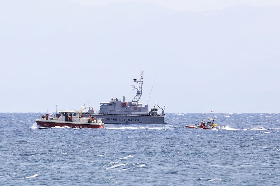 Emergency services at the scene of the search for a missing boat, in Porticello Santa Flavia, Italy, Monday, Aug. 19, 2024. British tech giant Mike Lynch, his lawyer and four other people are among those missing after their luxury superyacht sank during a freak storm off Sicily, Italy's civil protection and authorities said. Lynch's wife and 14 other people survived. (Alberto Lo Bianco /LaPresse via AP)