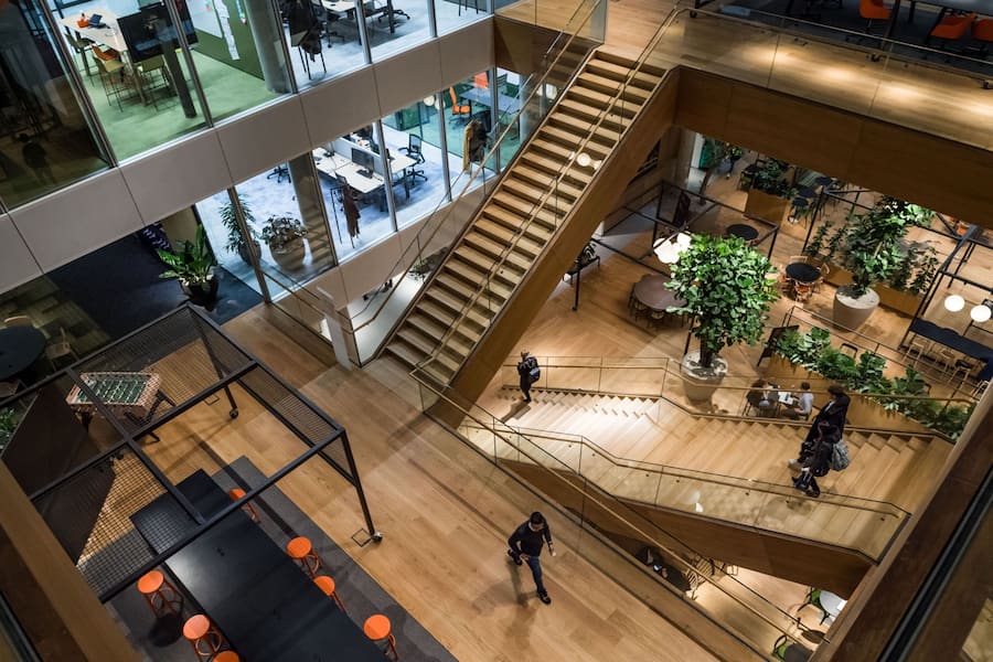 Attendees descend the central atrium staircases inside the new ING Groep NV Cedar campus headquarters at Cumulus Park in Amsterdam, Netherlands, on Tuesday, Jan. 7, 2020. The Dutch bank is scheduled to report full year earnings on February, 6. Photographer: Geert Vanden Wijngaert/Bloomberg