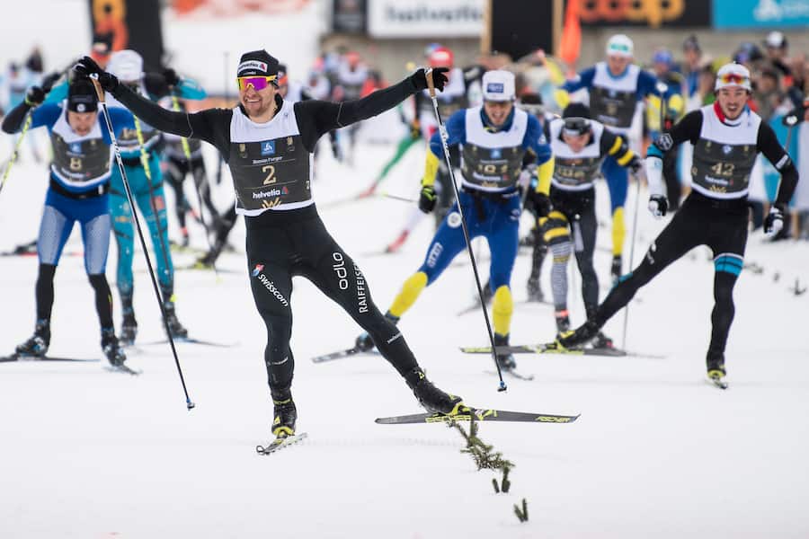 Roman Furger of Switzerland, winner, celebrates after the Engadin skiing marathon in the finish area in S Chanf, on Sunday, March 11, 2018. (KEYSTONE/Peter Schneider)