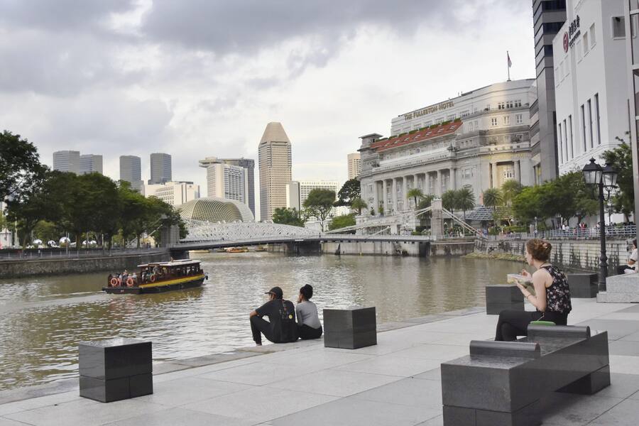 People are pictured at a riverside spot in Raffles Place, the center of the financial district in Singapore, on Nov. 27, 2018. (Kyodo)==Kyodo(Photo by Kyodo News Stills via Getty Images)