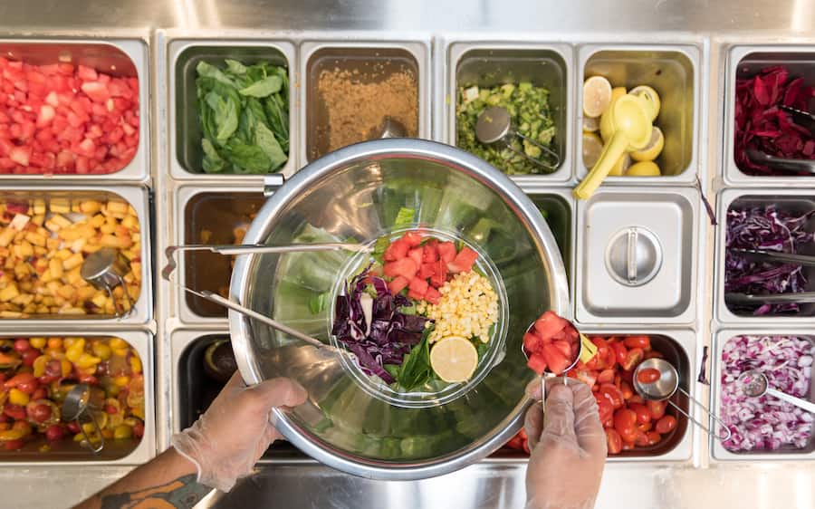 WASHINGTON, DC - SEPTEMBER 18: Watermelon being added to the spicy crab and watermelon salad at Sweetgreen in Washington, DC on September 18, 2017. (Photo by Dixie D. Vereen/For The Washington Post via Getty Images)