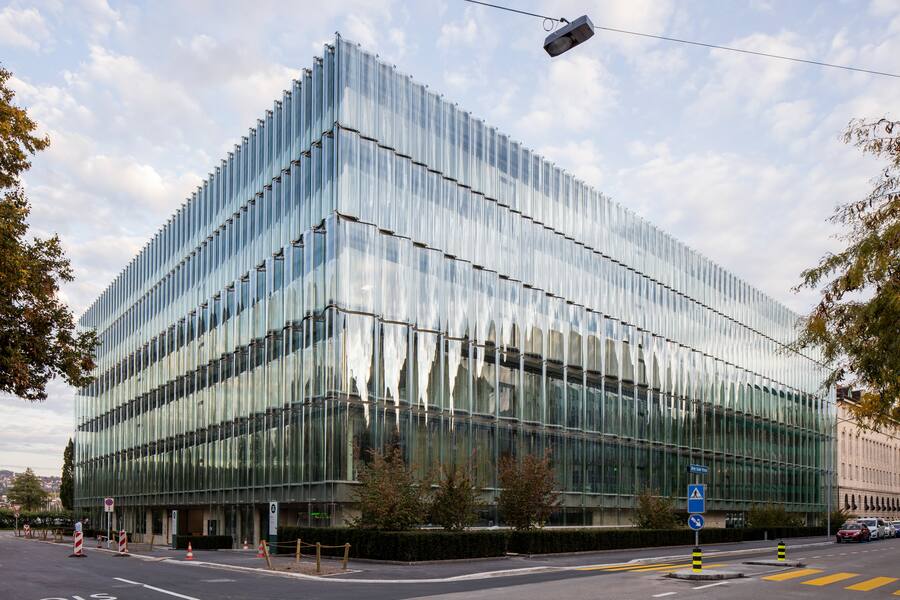 Corner elevation of undulating glass facade. Swiss Re Office headquarters, Zurich, Switzerland. Architect: Diener & Diener, 2017. (Photo by: Christian Richters/View Pictures/Universal Images Group via Getty Images)